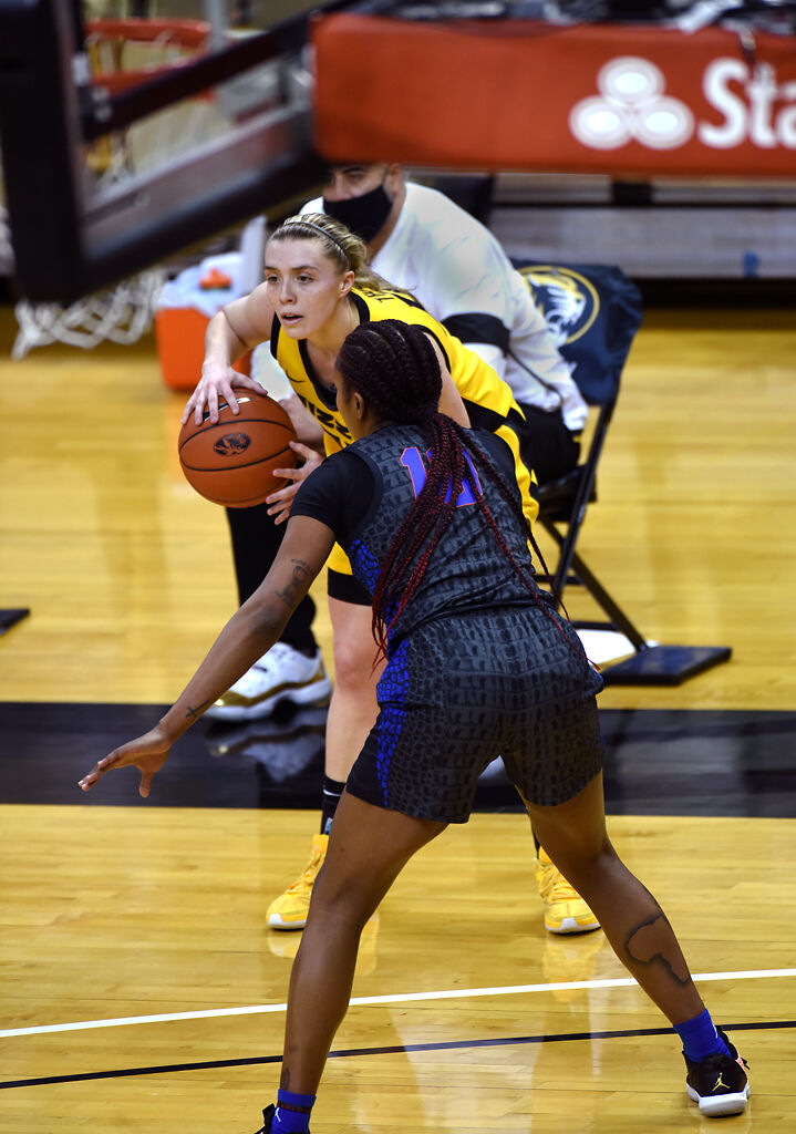 Haley Troup looks to pass the ball to a teammate